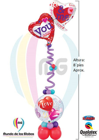 Pedestal: Corazones "You & Me" de 42" Metálico con tira de globos largos estilizado con globos de 3" a 5" & base burbuja "I love You" de 22" y latex de 5" y 12" bajo la base.